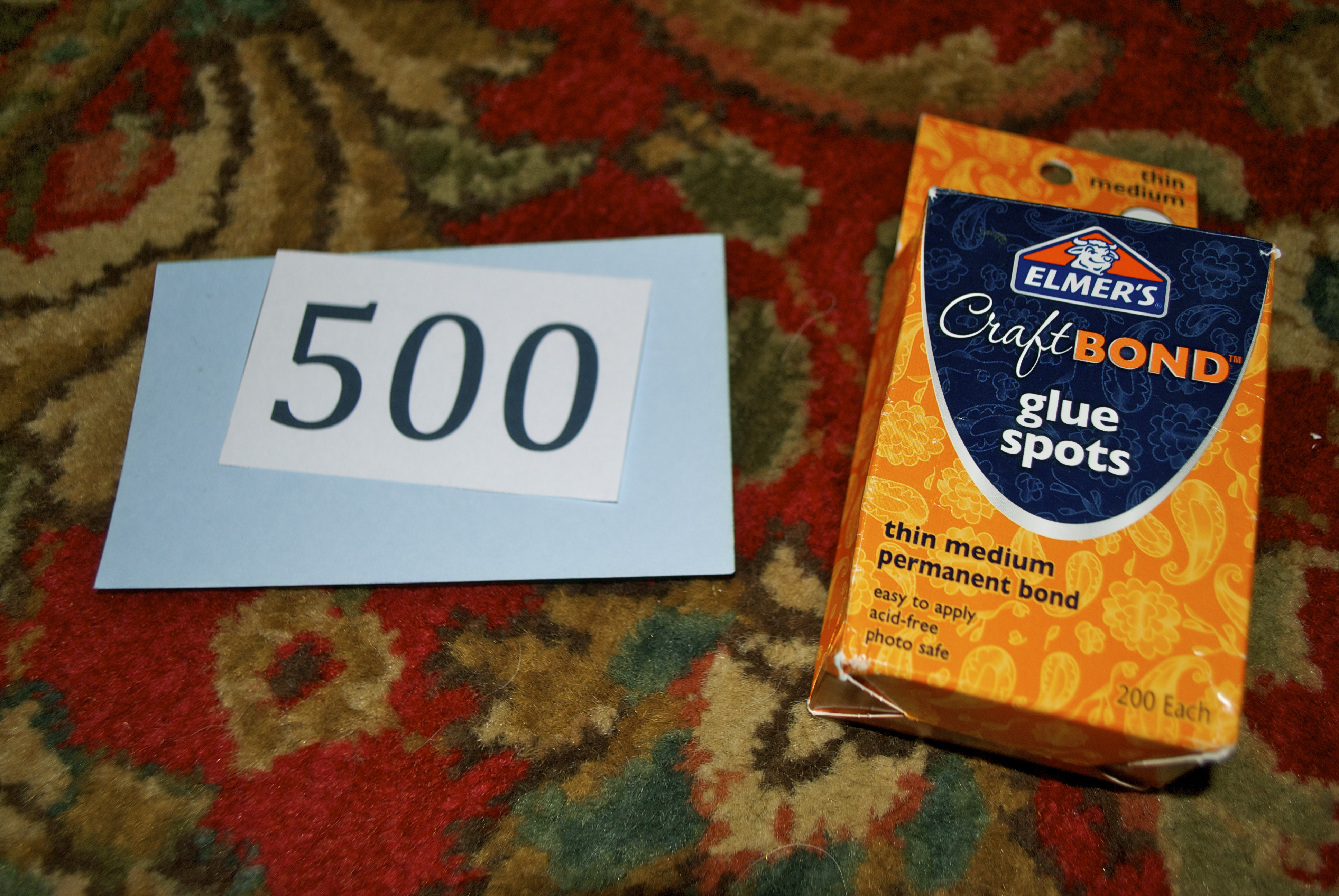 Attaching numbers to index cards for a Jeopardy game using glue dots
