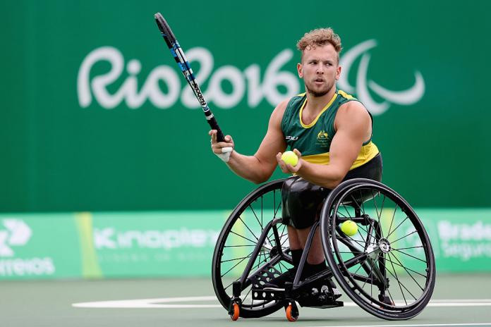 Australian wheelchair tennis player Dylan Alcott in action at the Rio 2016 Paralympics, showcasing his athleticism and determination