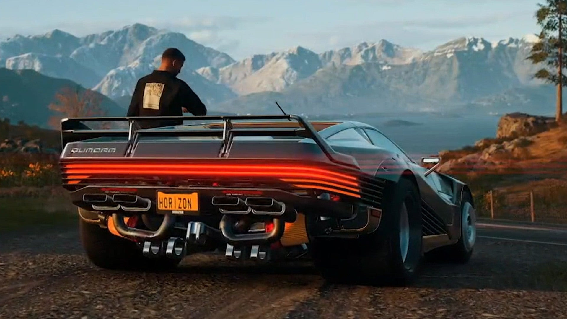 c sports car with mountains in the background