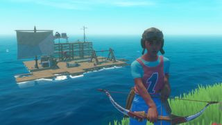 Person standing near raft holding a bow