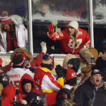 Taylor Swift celebrates with fans during the AFC Wild Card Playoffs between the Miami Dolphins and the Kansas City Chiefs at GEHA Field at Arrowhead Stadium on January 13, 2024 in Kansas City, Missouri.