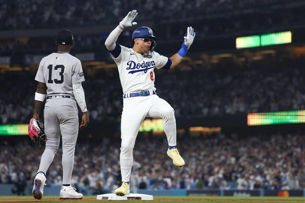 Kike Hernández #8 of the Los Angeles Dodgers celebrates after hitting a triple in the fifth inning against the New York Yankees during Game One of the 2024 World Series at Dodger Stadium on October 25, 2024 in Los Angeles, California