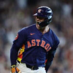 Christian Walker celebrates after hitting a walk-off home run against the Mariners
