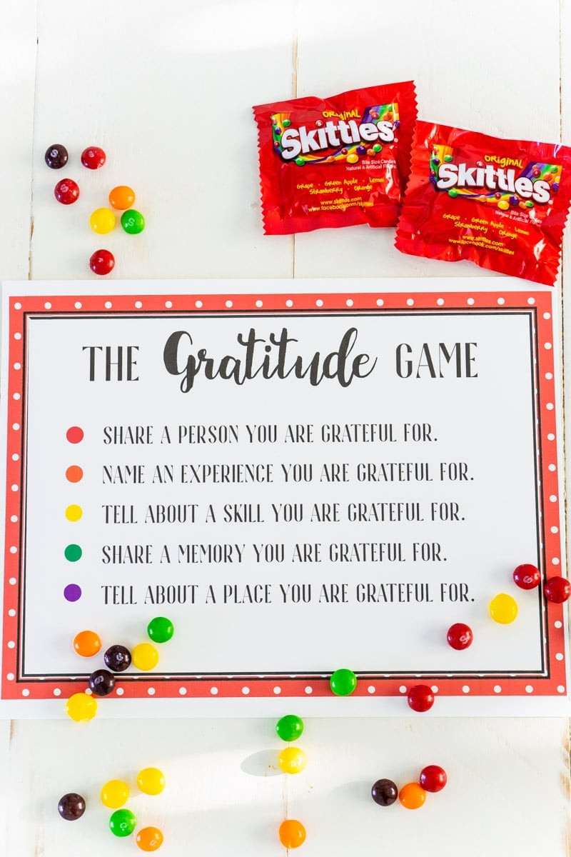 A 'Gratitude Game Board' with Skittles, designed to prompt thoughtful answers