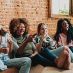 Group of friends watching a game show