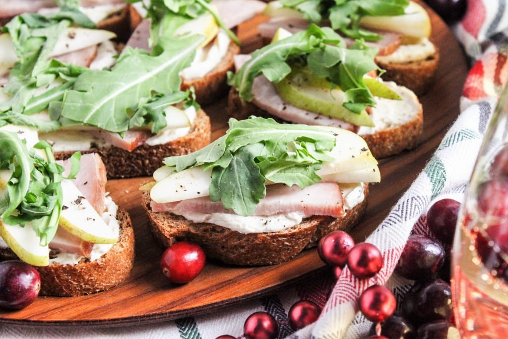 Ham and pear crostini appetizer with goat cheese