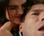 Lucy Hale as Lucy and Austin Stowell as Josh in The Hating Game, showcasing their on-screen chemistry and capturing the essence of their complicated relationship.