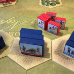 Dice in a dungeon setting, representing tabletop games and the challenges of game design