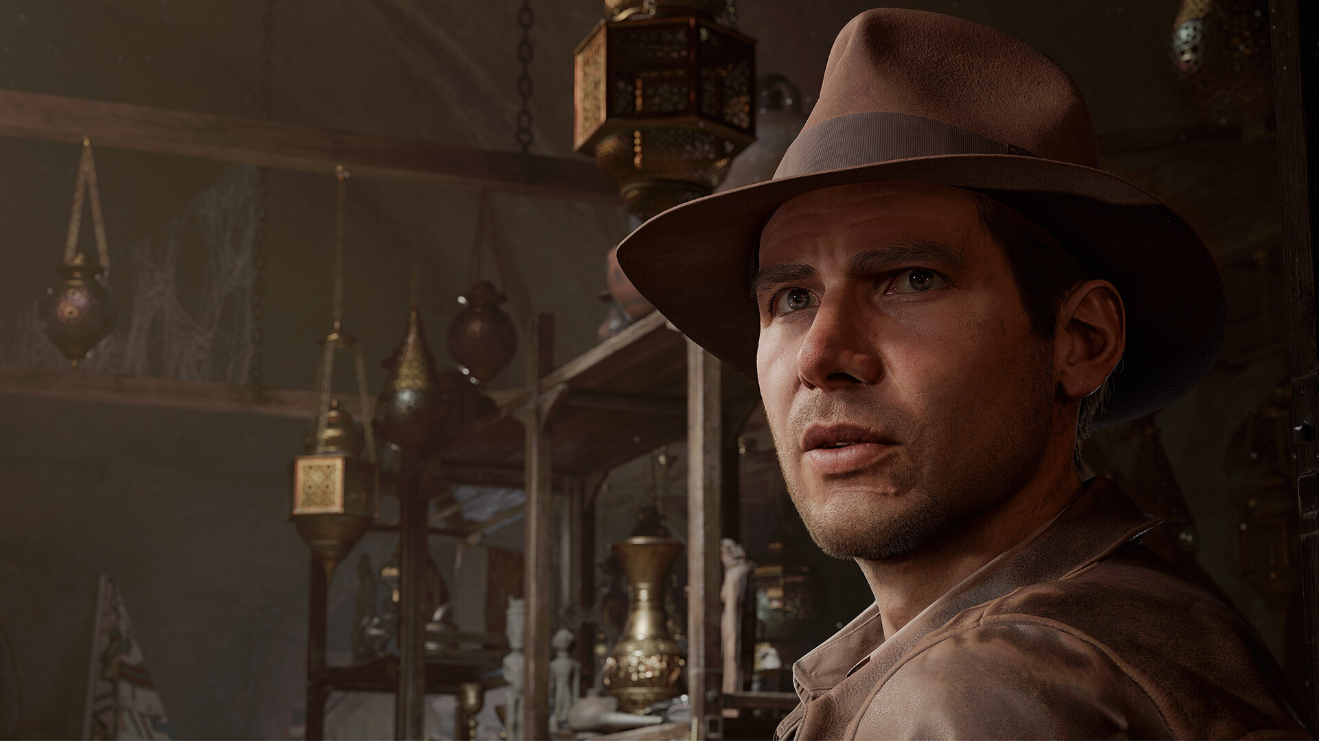 Indiana Jones, with his trademark fedora on, turns to face the camera in front of shelves stacked with artifacts in The Great Circle