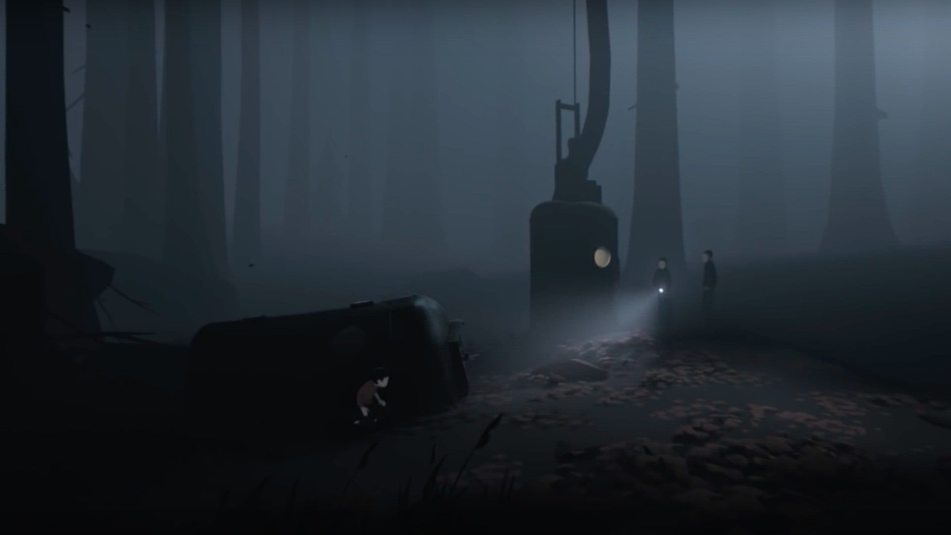 A boy hides from people with torches