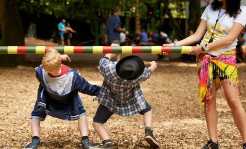 Kids playing the limbo