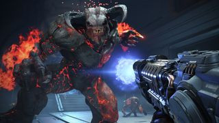 Screenshot from the video game Doom Eternal. A fiery hideous demon is lunging forward, ready to strike. It