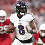 Lamar Jackson throws a pass