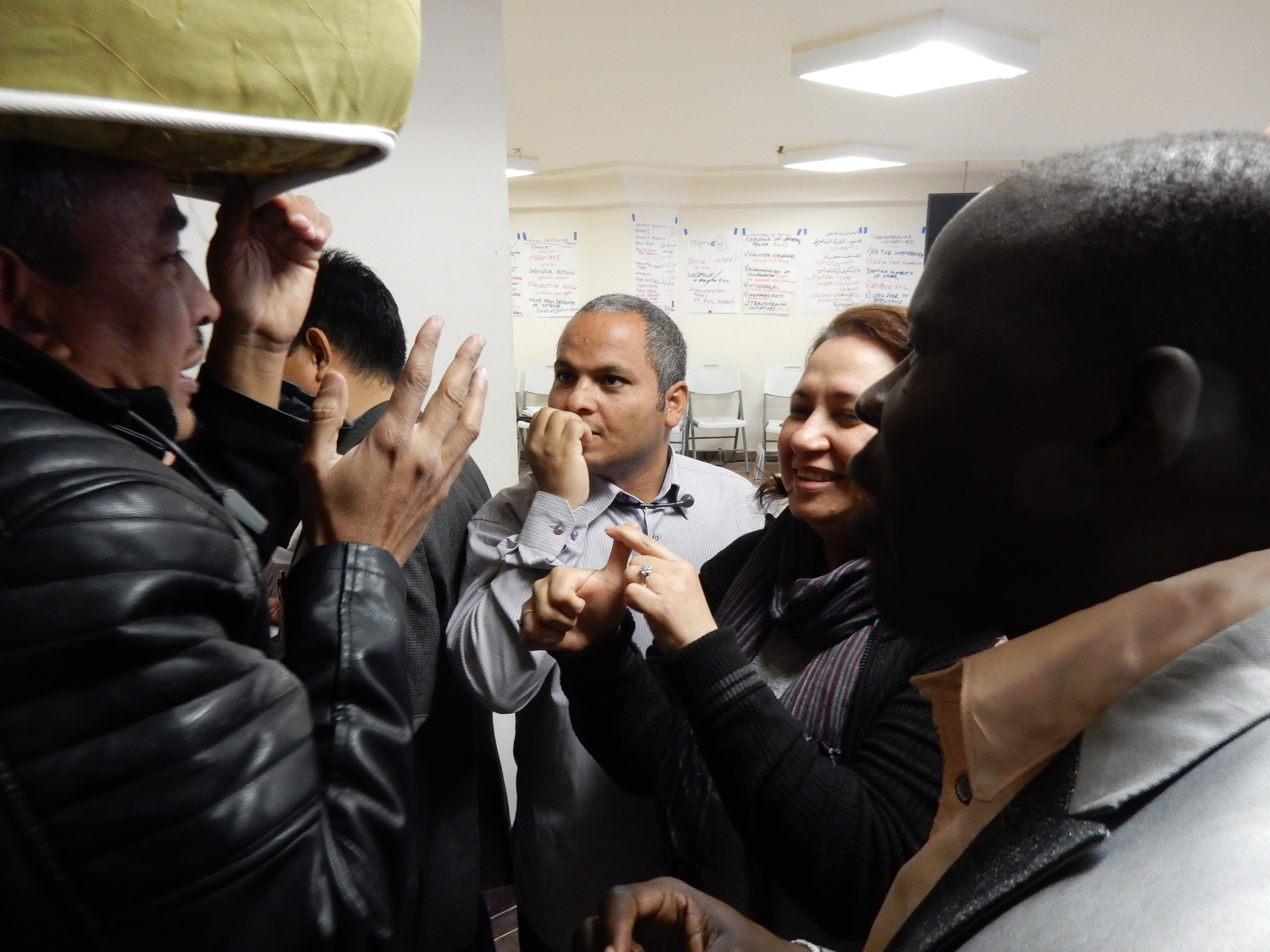 Action groups find their assigned pillar and begin telling or even acting out their ideas