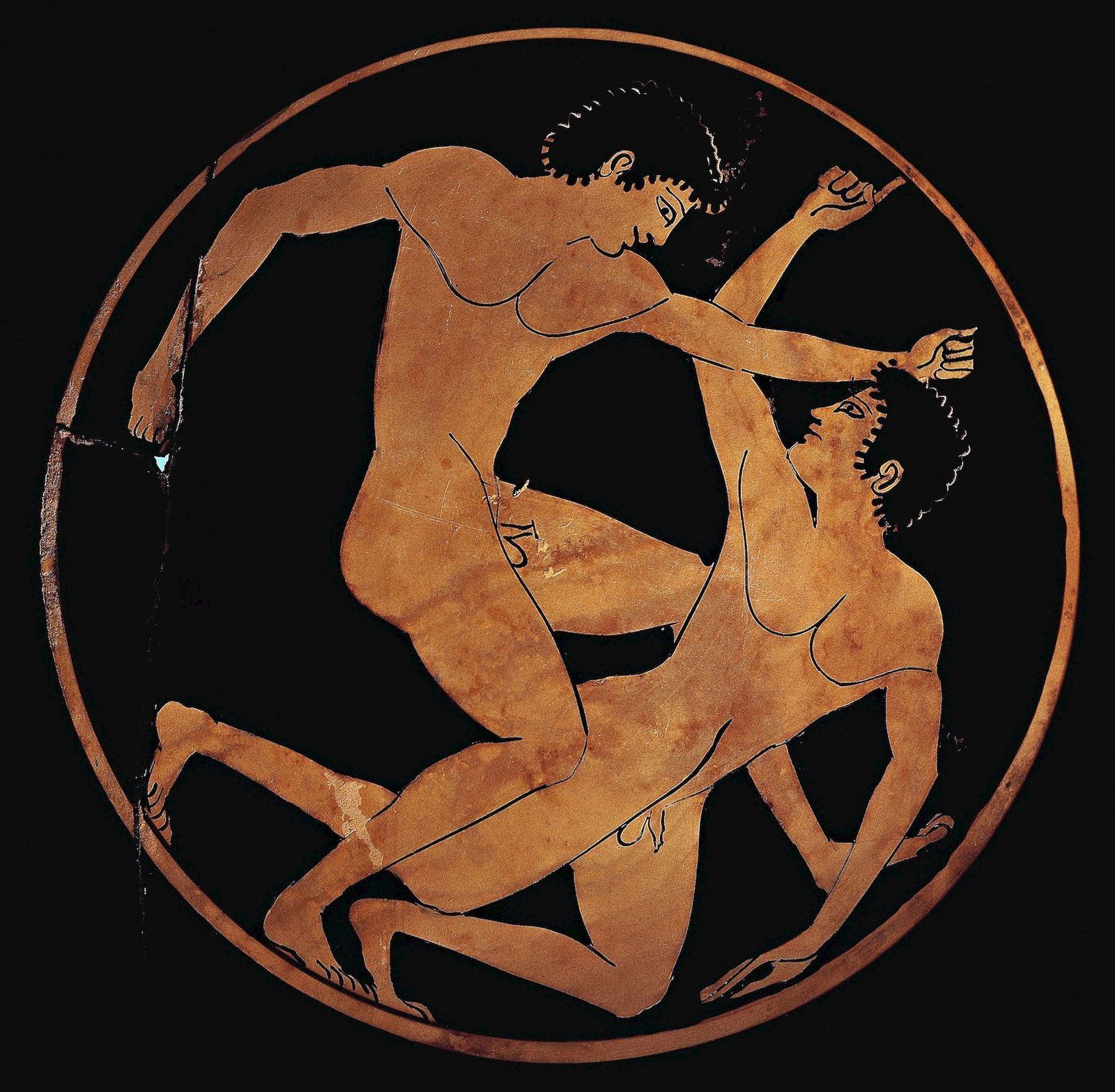 Wrestlers depicted on an ancient Greek cup