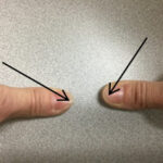 Illustration of a moon phase trick using thumbs to remember waxing and waning