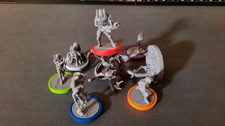 All six character minis surrounding an adult intruder.
