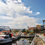 The Vol Navy is parked along the Neyland Greenway in downtown Knoxville, TN. Neyland Stadium and Thompson- Boling Arena are in the distance.