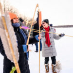 Diana Vera from the Otomi Tribe fits a spear onto an atlatl.
