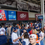 Image of fans at the Dr. Pepper Patio in Soldier Field getting hyped for the game ahead of them