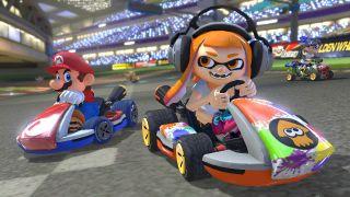 A squid girl and Mario racing each other during the Nintendo Switch game Mario Kart 8 Deluxe.