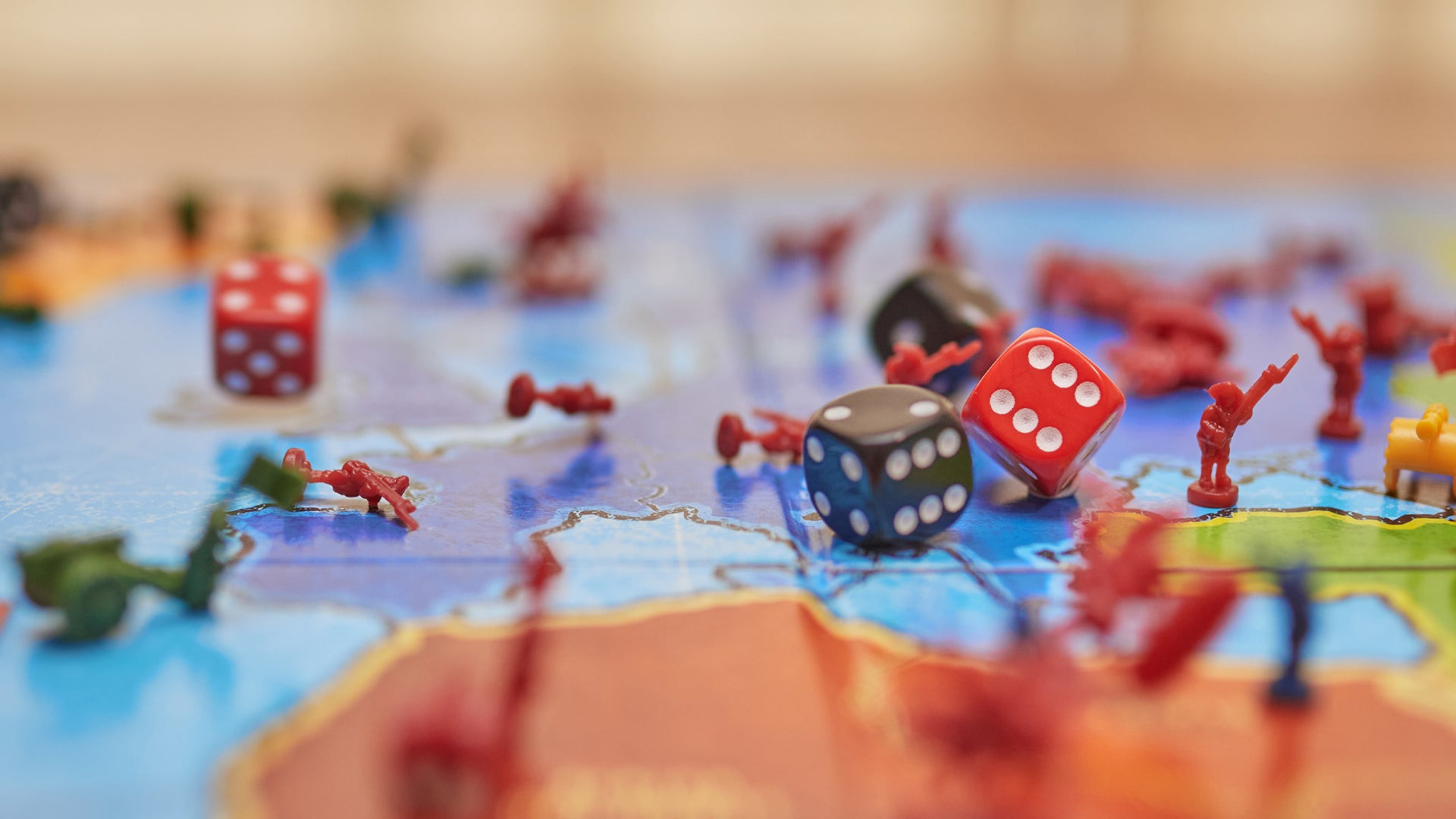 Close-up of Risk game dice showing various numbers, emphasizing the role of chance and strategy in the game
