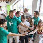 A photograph of the SessionLab team playing Human Knot.