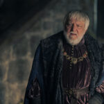 Ser Simon Strong (Sir Simon Beale) looks puzzled in a scene set at Harrenhal in House of the Dragon season 2 episode 4, highlighting his role in the castle's events