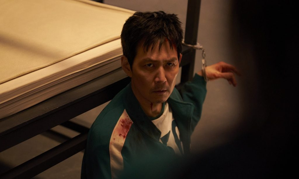 Lee Jung-jae as Gi-hun in Squid Game 3, with a resolute look on his face