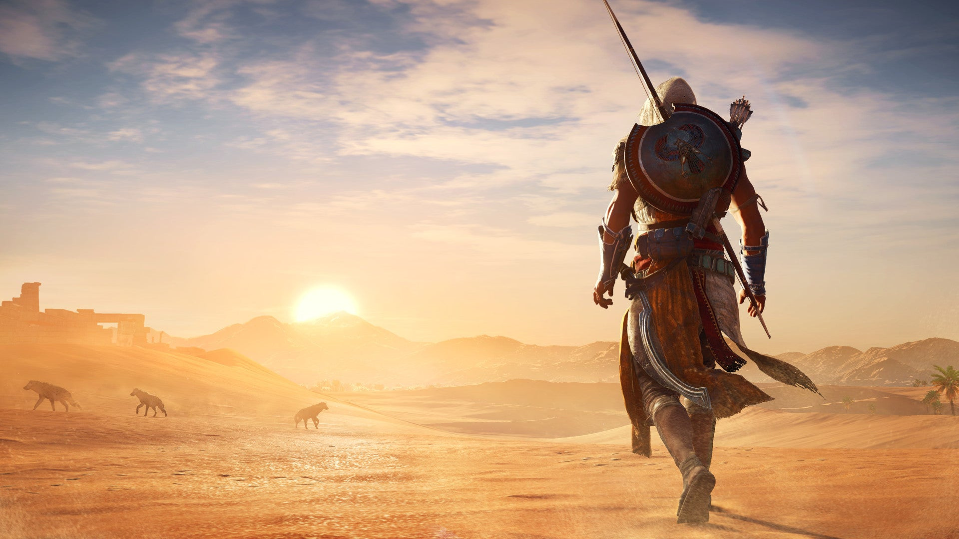 A hooded figure walks through the Egyptian desert