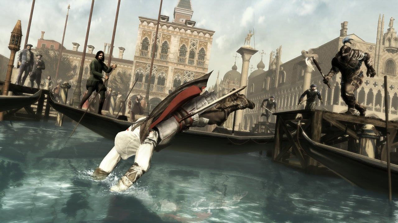 A hooded man dives into water as a guard chases him