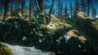 Blue and red yarn monsters hanging above a stream in Unravel 2