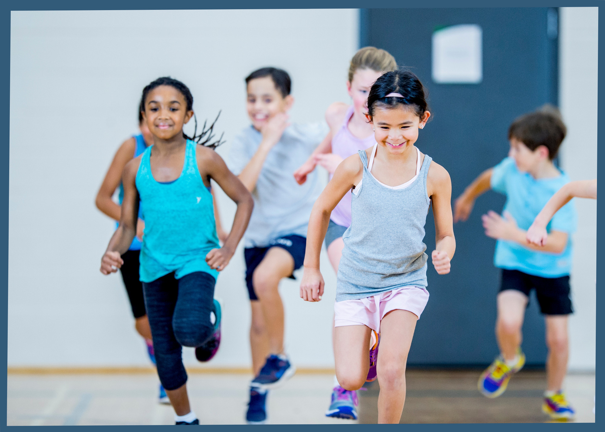 Students playing a tag game as a warm-up, enhancing agility and coordination.