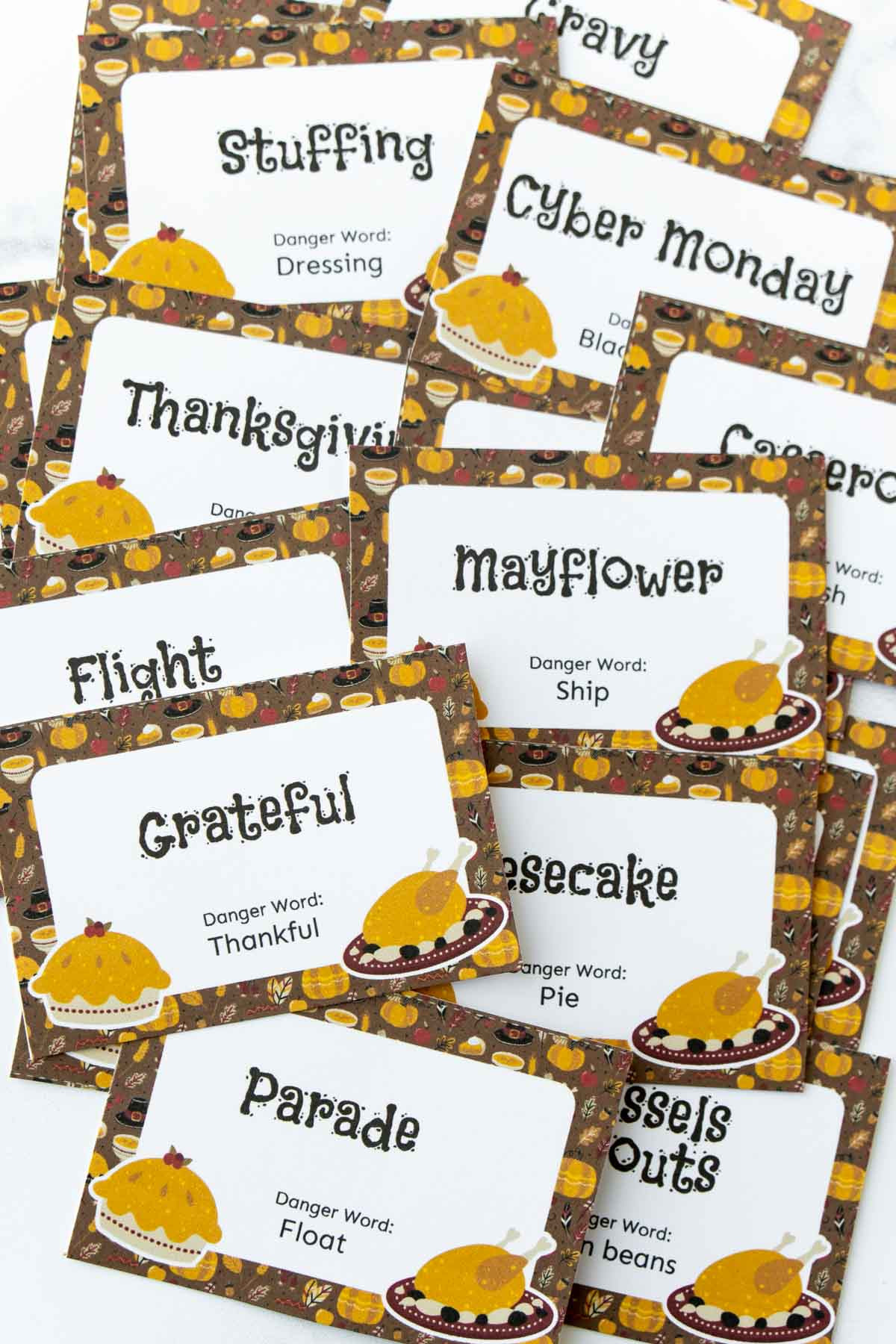 A collection of cut-out 'Thanksgiving Danger Word' cards, ready for a thrilling game