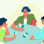 three people playing cards