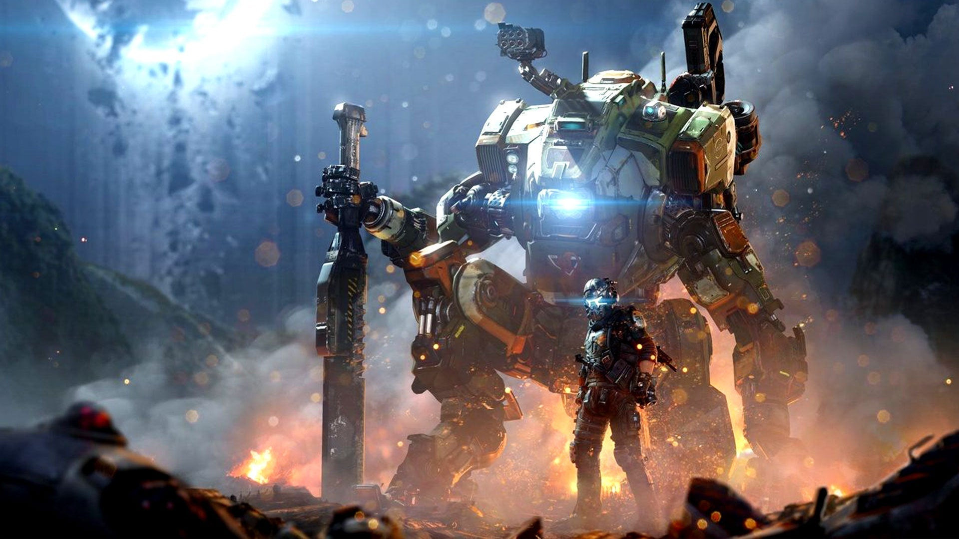 A large mech with a person standing in front of it