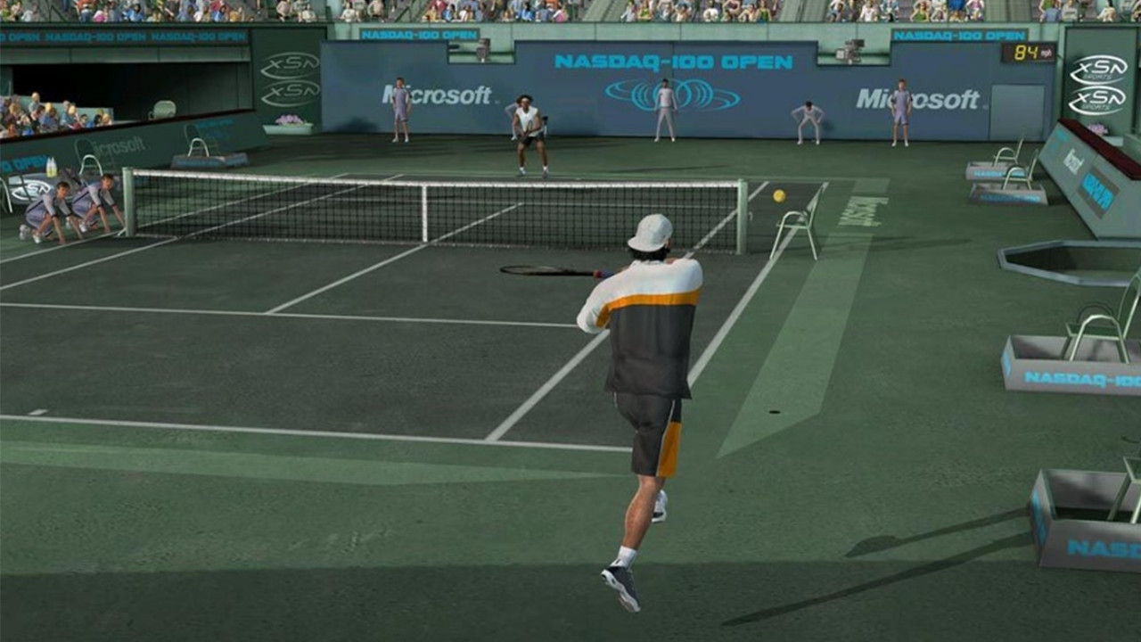 People playing tennis on a tennis court