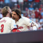 Bryce Harper and Nick Castellanos celebrate a home run during an NLDS game