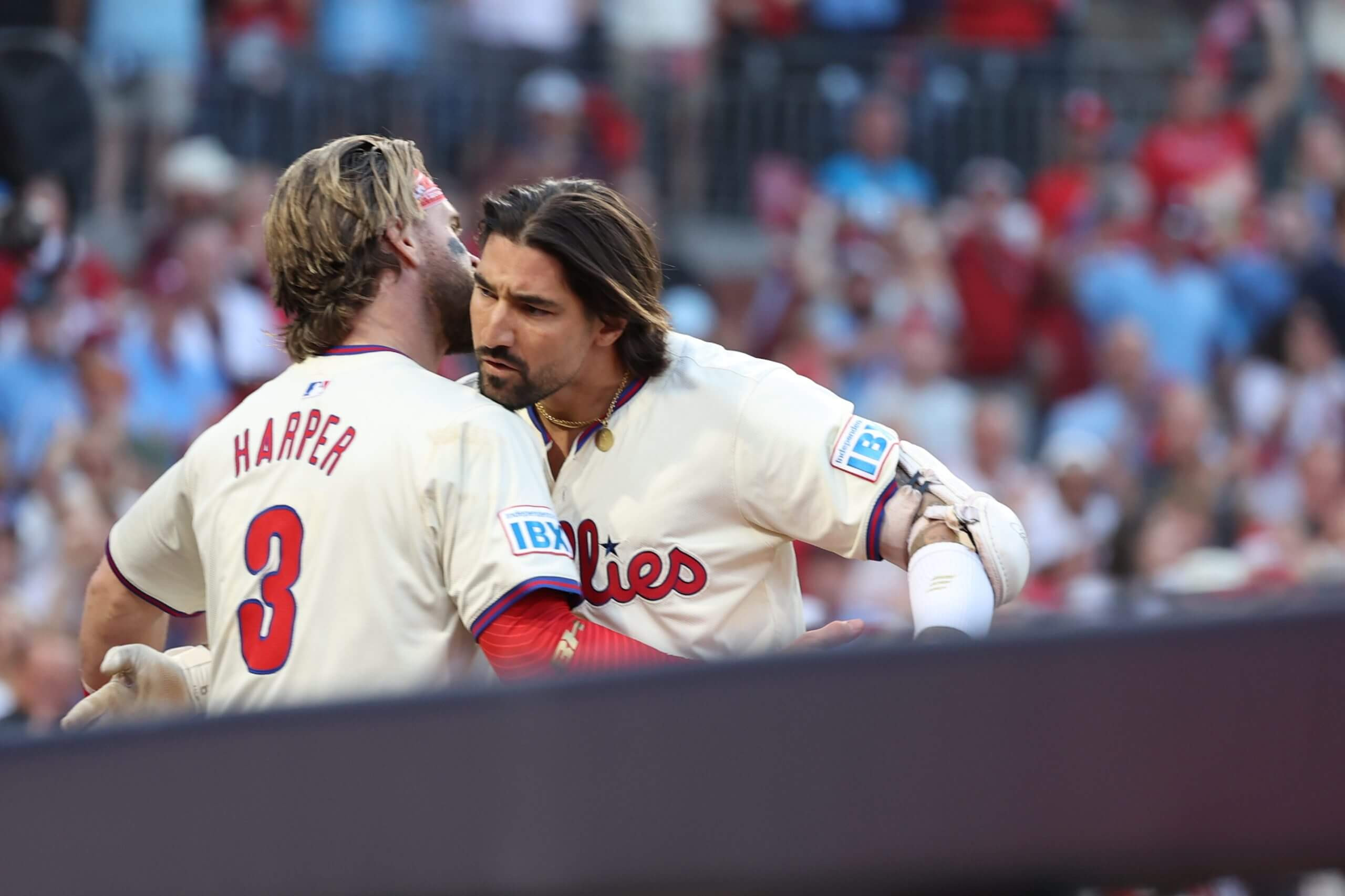 Bryce Harper and Nick Castellanos celebrate a home run during an NLDS game