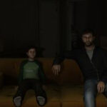 Ethan Mars watching TV with his son during one of the best PS3 games, Heavy Rain.