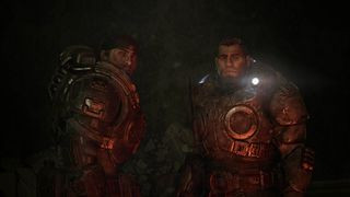 Gears of War: E-Day screenshot featuring two soldiers in a dark cave.