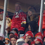 Taylor Swift with her family and Travis Kelce cheering on the Chiefs on Jan. 18, 2025.