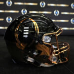 Navy Midshipmen celebrate their Commander-in-Chief's Trophy win with the team