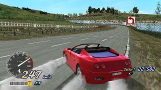 A screenshot from the PS2 game OutRun 2006: Coast 2 Coast, showing a red car skidding on a round with smoke coming out of its wheels