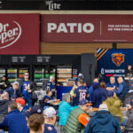 Fans enjoying the Dr. Pepper Patio at Soldier Field, listening to music and getting ready for a Chicago Bears game
