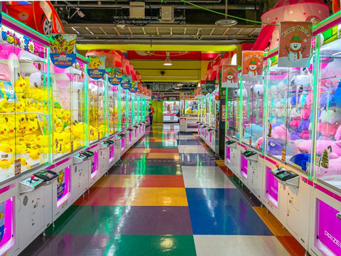 Unique crane game variation featuring a key claw mechanism, offering a different challenge to unlock prizes