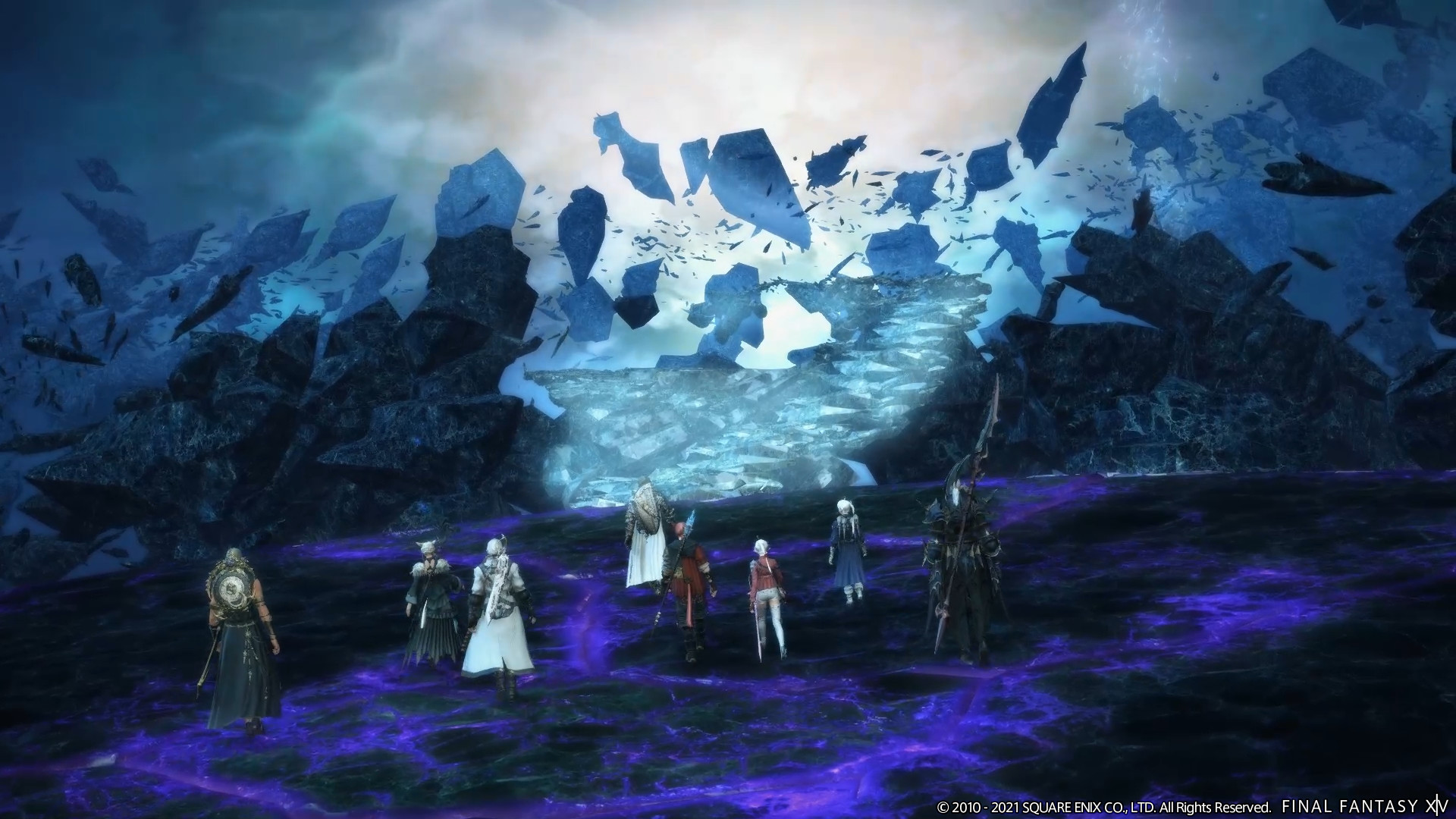 A cast of characters in Final Fantasy 14: Endwalker stands side by side and gazes out across a blueish, ethereal abyss, showing the game’s epic scope.
