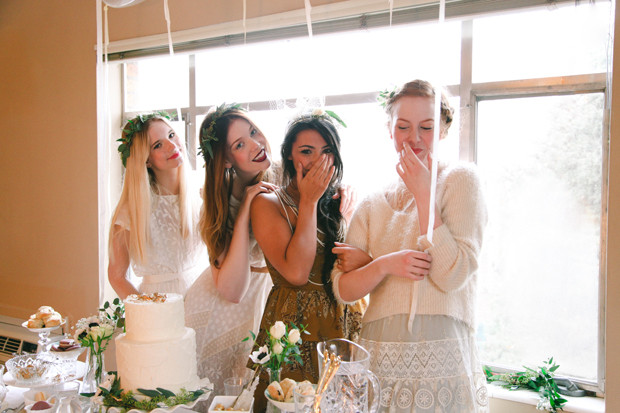 Bridesmaids smiling and laughing at a bachelorette party featuring Mr. and Mrs. game questions