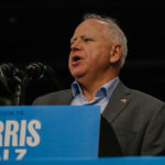 Minnesota Gov. Tim Walz speaks onstage at a Harris-Walz campaign rally