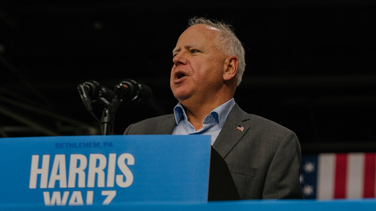 Minnesota Gov. Tim Walz speaks onstage at a Harris-Walz campaign rally